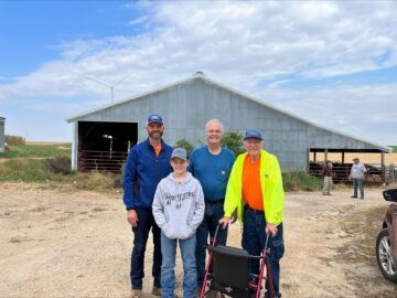  Four generations of the Wick family standing in front of a 1955 Wick cattle shed
